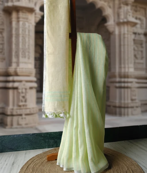 Light yellow and green striped pure linen saree with silver zari border for office wear